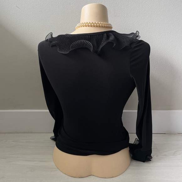 black long-sleeved women's blouse featuring a ruffled neckline and floral lace - Picture 2 of 6